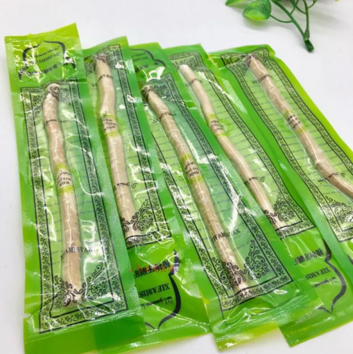 Pack of Natural Miswak tooth cleaning sticks in green sachets