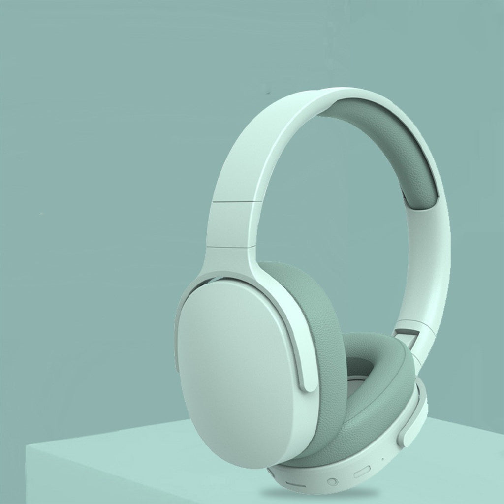 Mint blue over-ear headphones with padded headband and ear cushions, control area shown