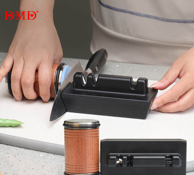 Adjustable angle knife sharpener set in use: fixed knife blade held on black base
