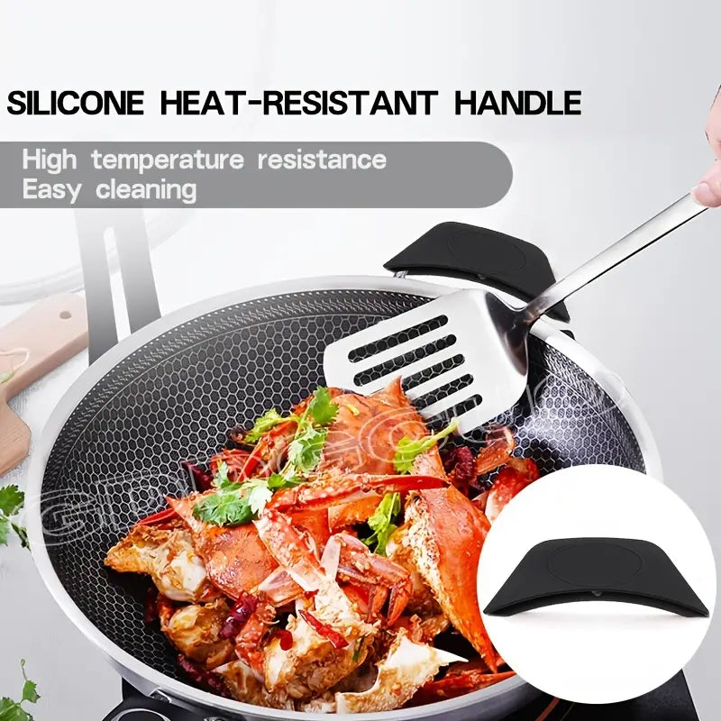 Black heat-resistant silicone handle holder clip shown on a skillet handle near cooking