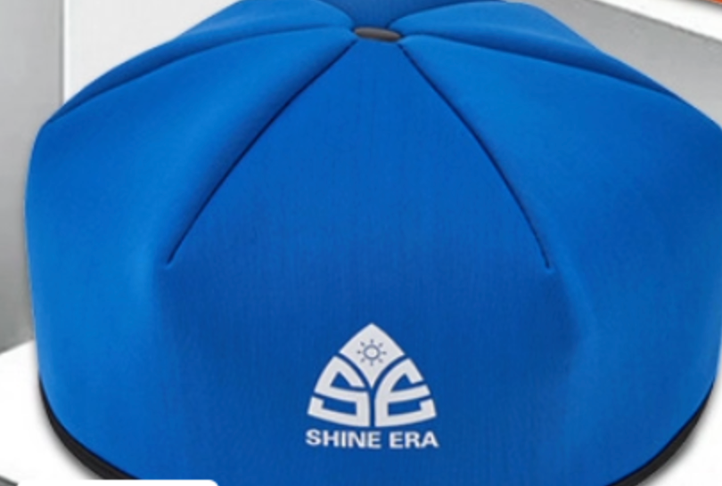 Blue hair rejuvenation helmet with logo on the top panel