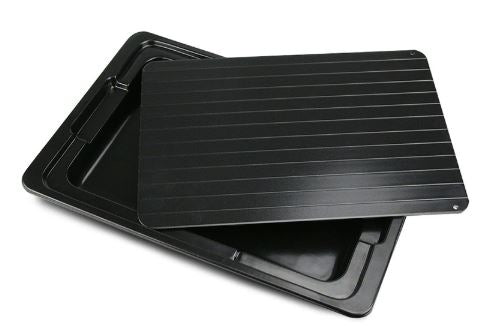 Black quick-thawing plate with ridged surface and stacked base tray for home kitchen use