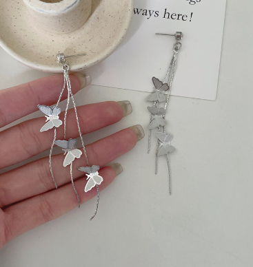 Silver-tone butterfly tassel ear clips, four small butterflies on thin chain