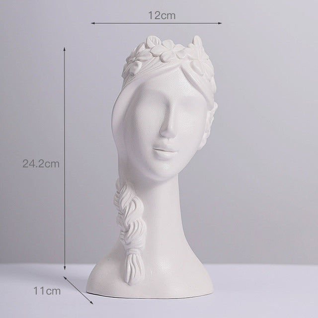 Matte white ceramic vase with female head relief and textured floral crown