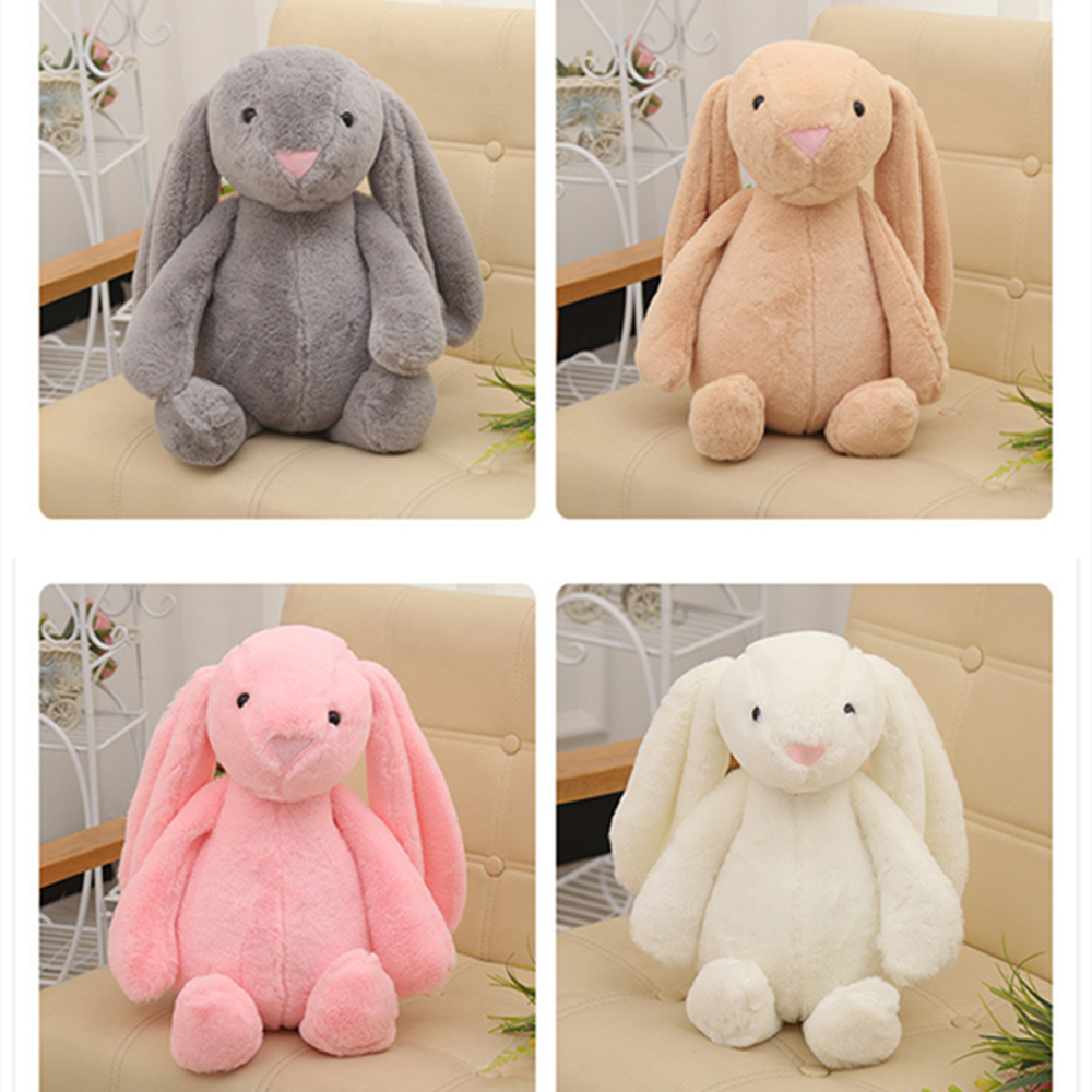 Set of long-eared bunny plush toys: gray, tan, pink, and white on display
