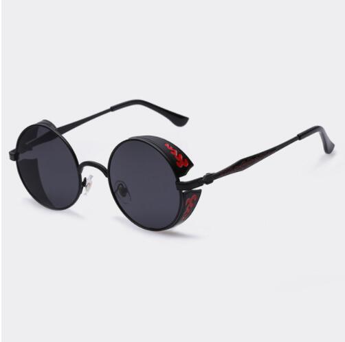Women’s round sunglasses with black lenses and dark frames, red emblem on temples