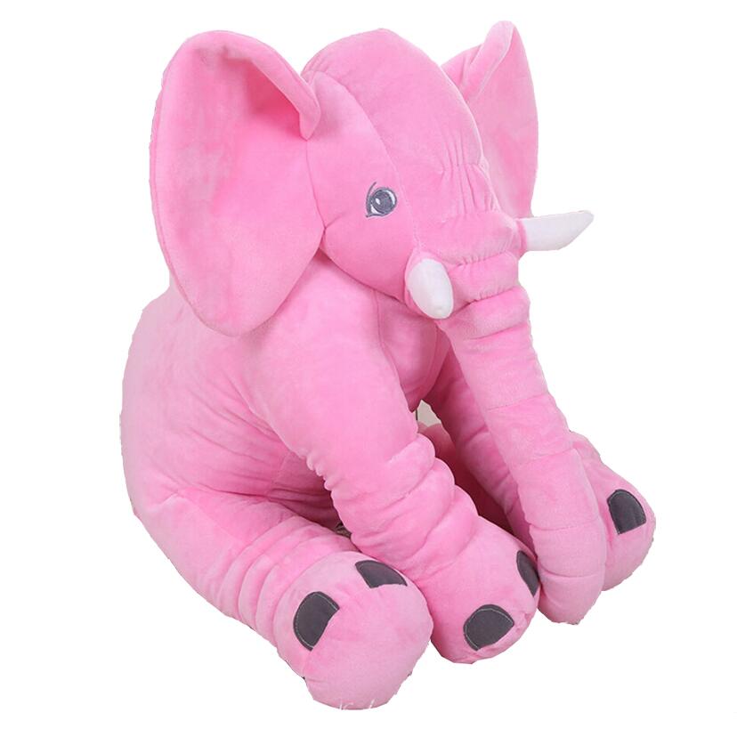 Pink plush elephant toy and pillow companion, seated on the padded back cushion