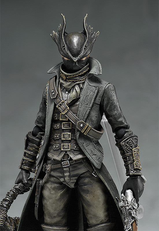 Black hunter action figure close-up, armored vest, belt straps and masked head