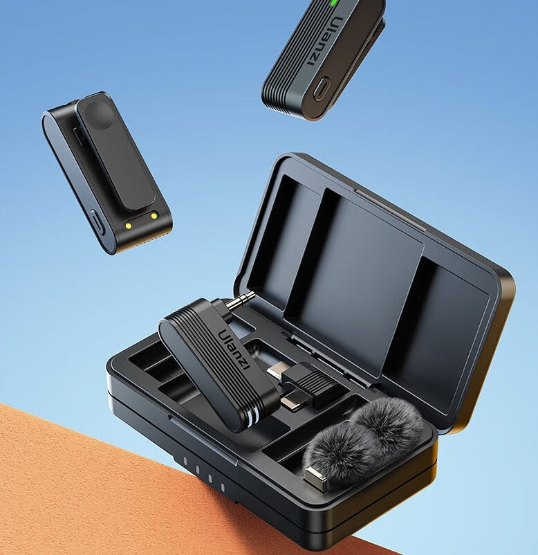 Close-up of black A100 wireless lavalier charging case with two transmitters and foam windscreens