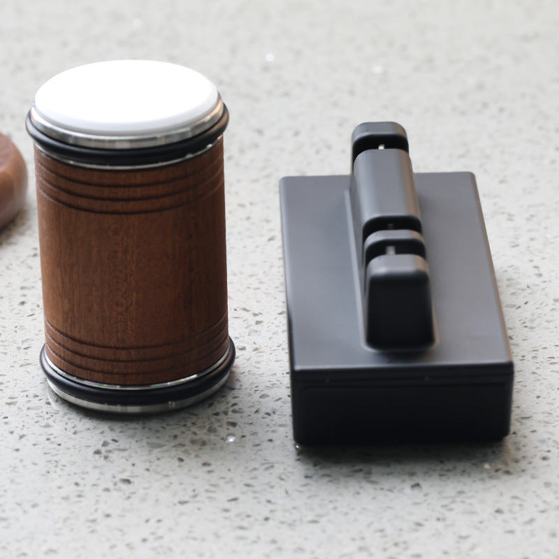 Adjustable angle knife sharpener set with brown wooden base and black sharpening block