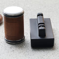 Adjustable angle knife sharpener set with brown wooden base and black sharpening block
