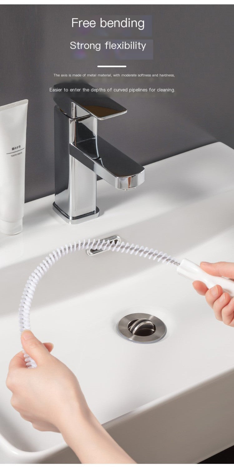 Flexible pipe drain hair cleaner brush with coiled bristles near a sink drain