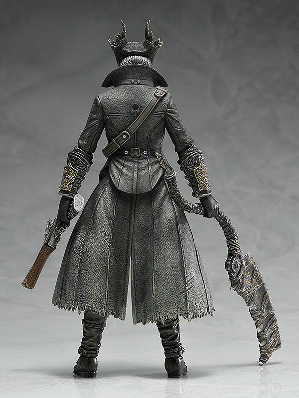 Black hunter action figure back view, spiked helmet, shoulder straps and flowing skirt