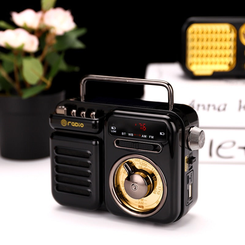 Schwarzer Retro-Solar Bluetooth-Lautsprecher mit goldener Skala und Drehregler