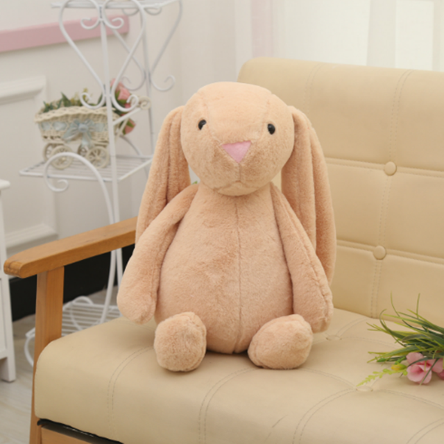 Long-eared bunny plush toy, tan-beige, sitting with pink triangular nose