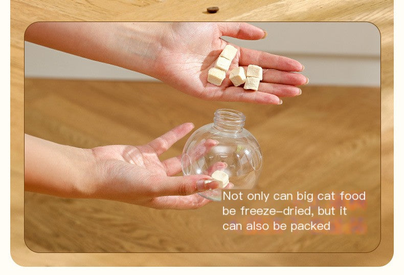 Cat Toy Leaky Ball: clear ball top with treat pieces in hands, spring pole