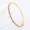 18k Gold bracelet with rainbow multicolor gemstone pave detail and clasp, side view