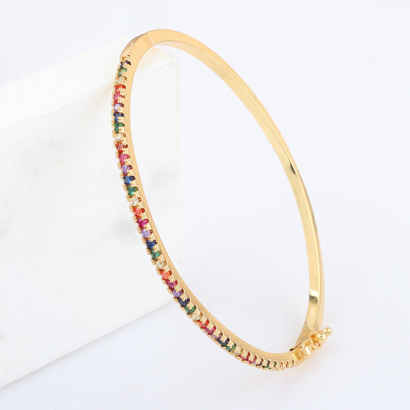 18k Gold bracelet with rainbow multicolor gemstone pave detail and clasp, side view