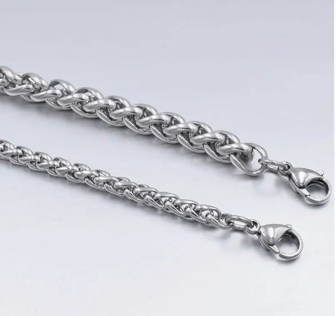 Silver Cuban link chain bracelet detail with lobster clasp and rounded oval links