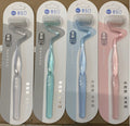 MLK S-Shape soft bristle toothbrushes in clear, teal, blue, and pink single packs