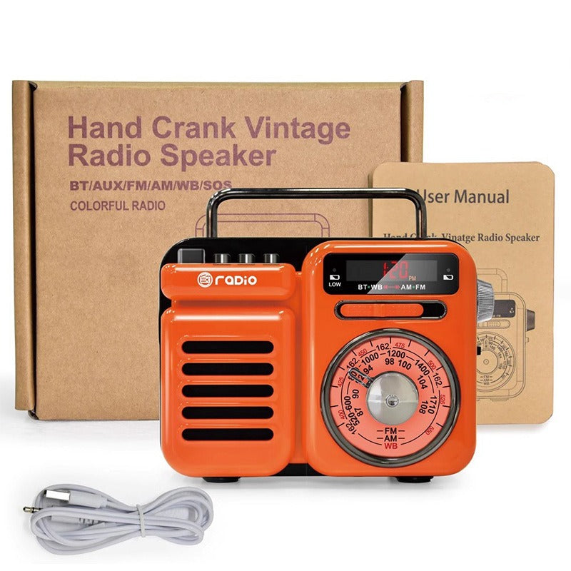 Orange retro solar Bluetooth speaker with crank-style tuning dial and top handle