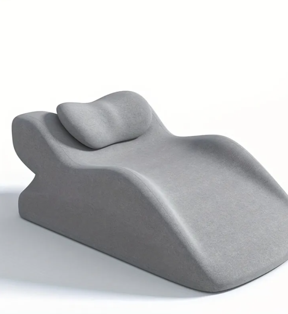 Stomach Sleeper Pillow in light gray with curved bolster shape and headrest