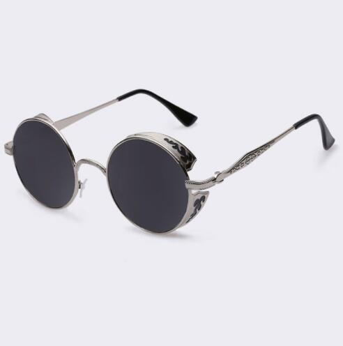 Women’s round sunglasses with dark lenses and silver-toned frames, textured temple arms