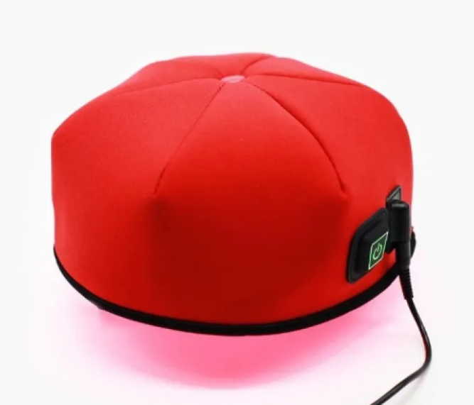 Red hair rejuvenation helmet with side control port and connected cable