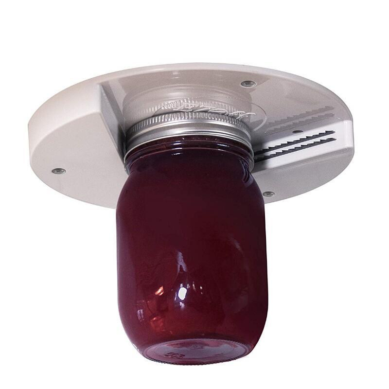 Close-up of jar under universal jar opener with white base and serrated metal blade