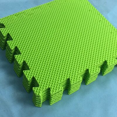Lime green foam puzzle floor mat panels with interlocking border pieces