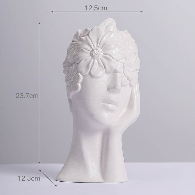 Matte white ceramic body vase with female head relief and layered flower texture