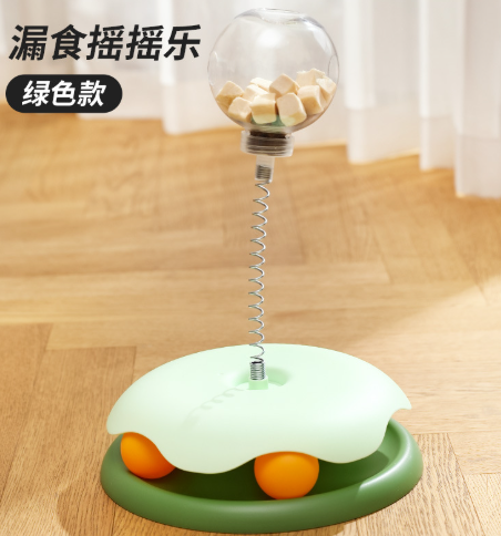 绿色款漏食摇摆球：透明球体+弹簧杆，浅绿色顶座与绿色底圈