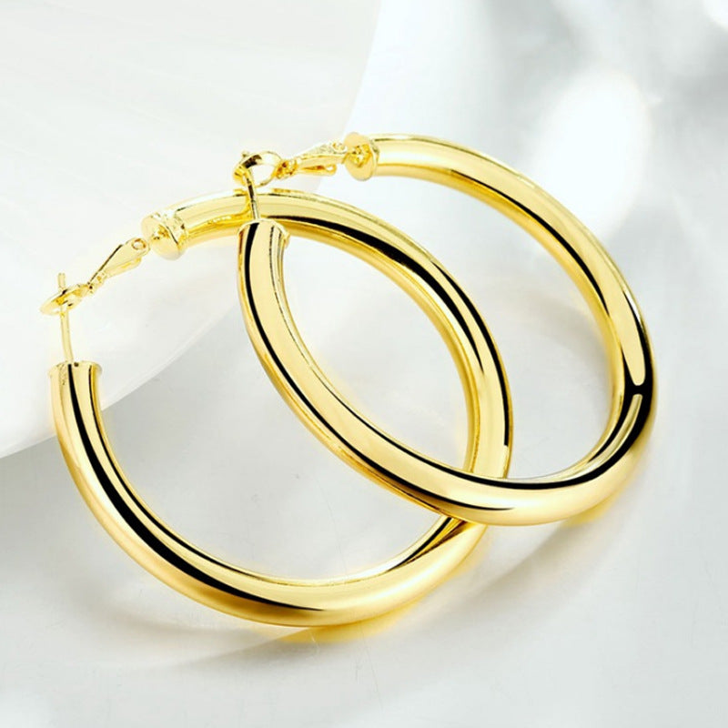Gold-tone hollow hoop earrings, round hoops with cross-style hinge clasp