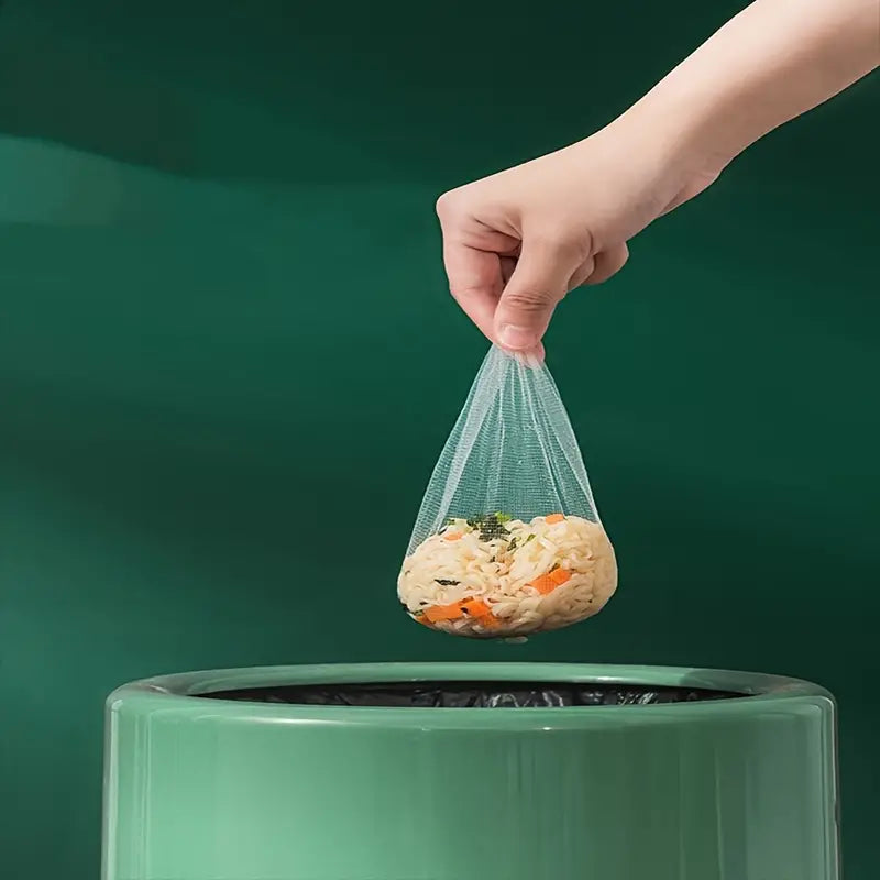 Mesh filter bag holding rinsed food, secured tie for kitchen sink straining