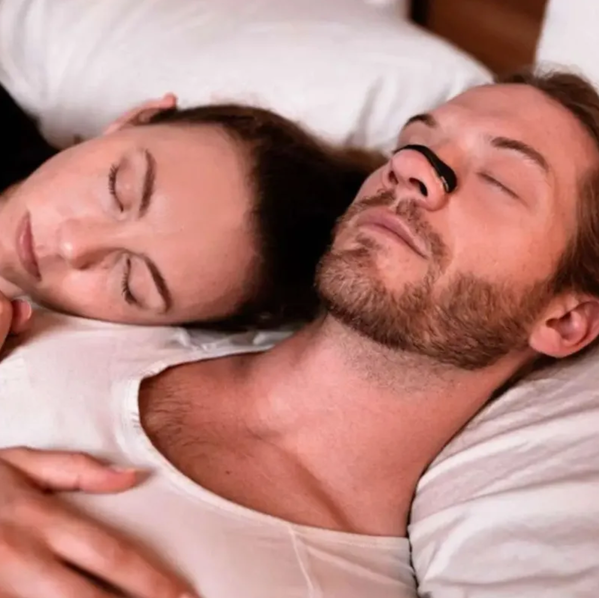 Black nasal dilator worn on nose while resting