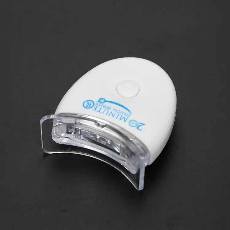 Teeth whitening mouth tray, clear plastic with white base and blue branding