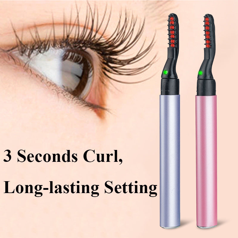 Electric eyelash curler pair—pink and silver—near eye eyelashes