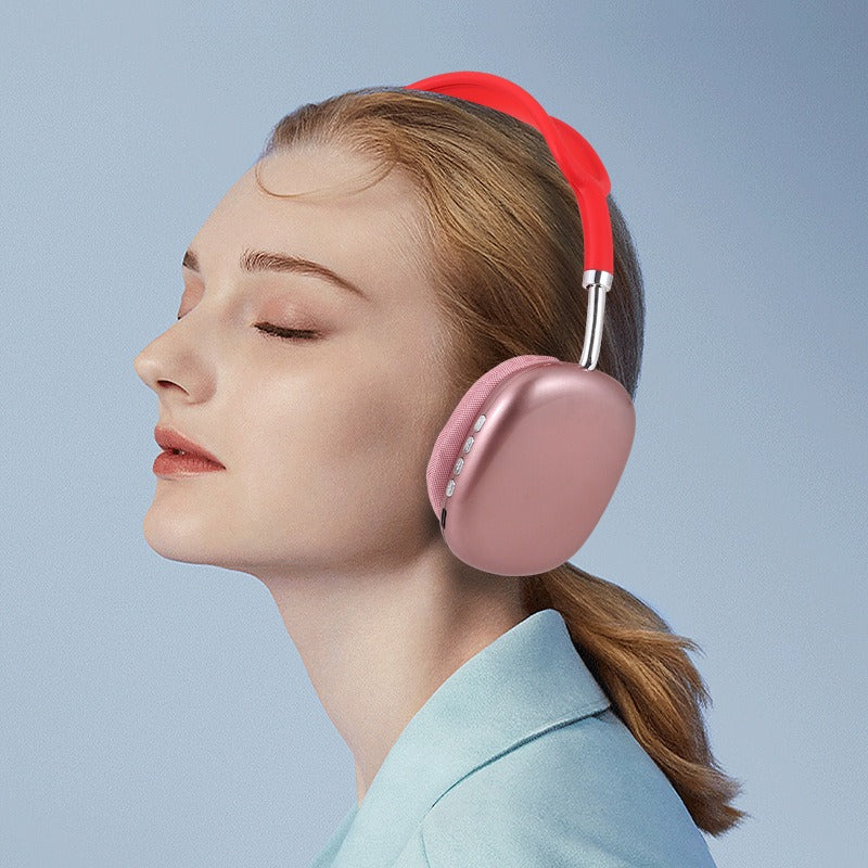 P9 Wireless Bluetooth-Kopfhörer, rosafarbene Over-Ear Muscheln am getragenen Kopf