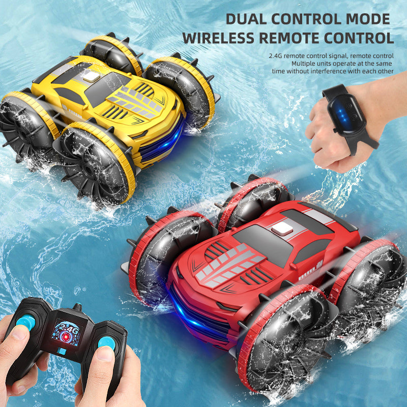 Red and yellow 2.4G stunt cars with a smartwatch remote in view