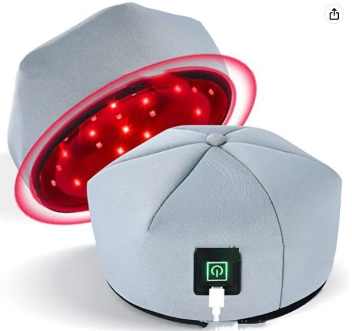 Grey hair helmet with red LED panel glow and visible power plug