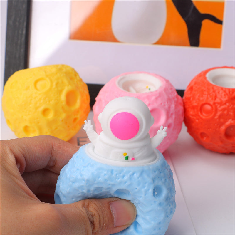 Astronaut vent cup music toy: blue squeeze ball with astronaut figure, plus yellow, pink, orange