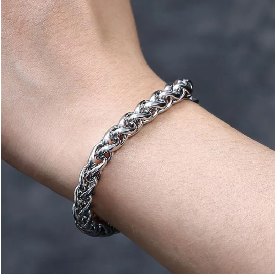 Men’s stainless steel rope chain bracelet on wrist, silver link pattern