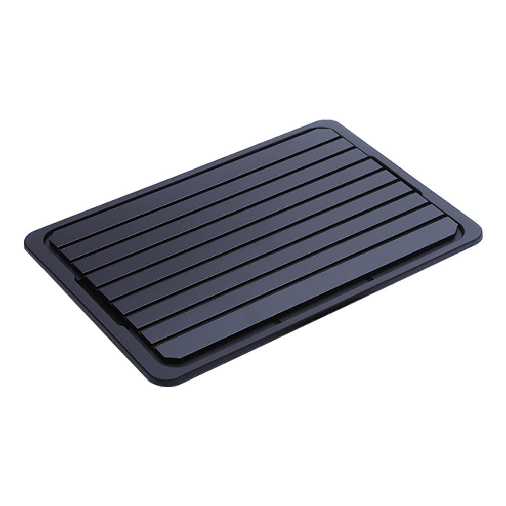 Black thawing plate with raised ridges and sturdy rectangular frame