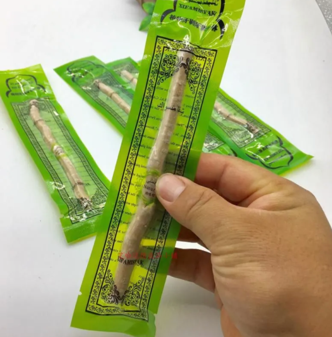 Miswak tooth cleaning stick in hand, Natural Miswak