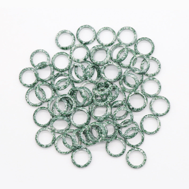 Green speckled agate running rings, translucent bands with green veining