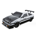 White RC drift car with black stripes, front lights and rear spoiler