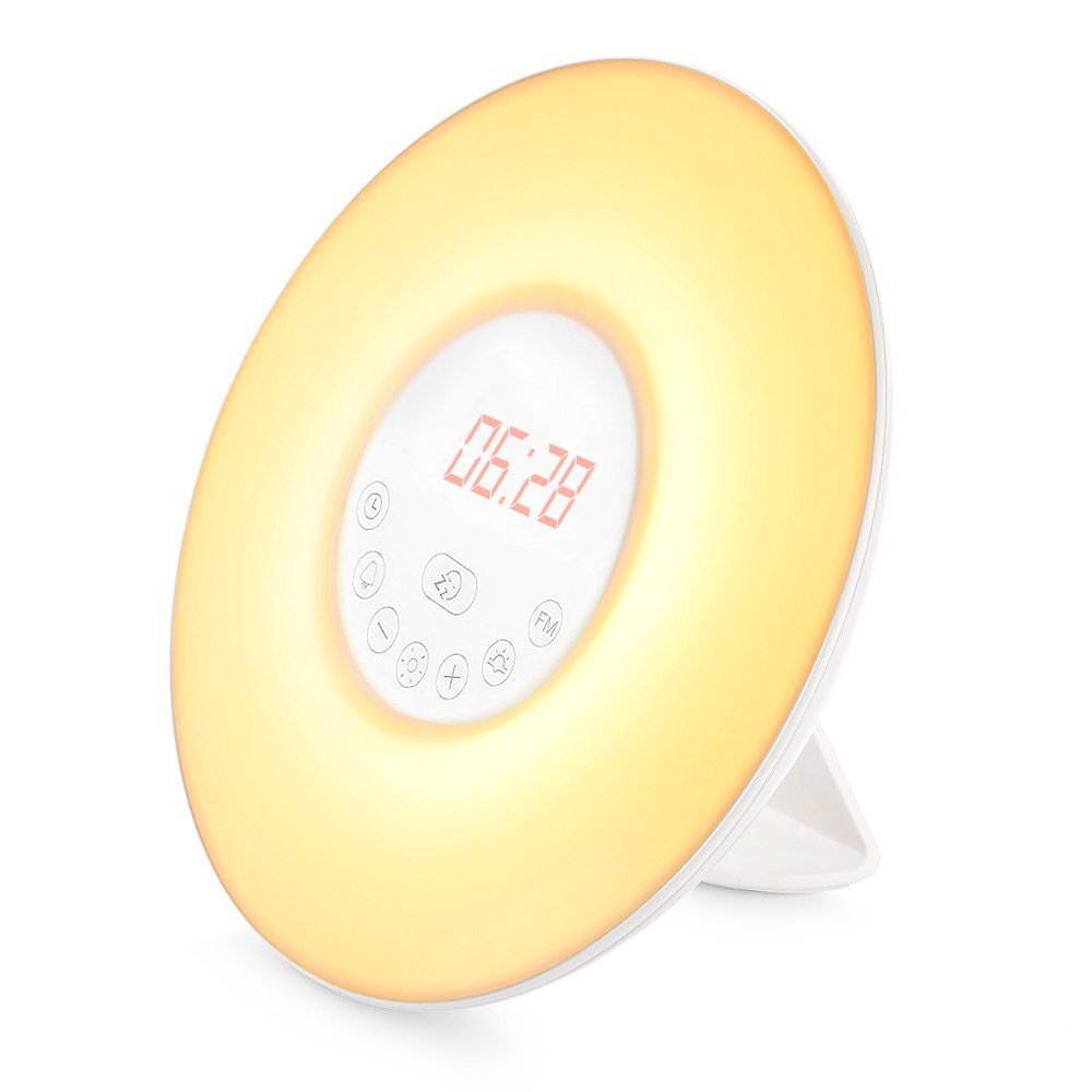 Yellow round alarm clock radio with red display 08:28 and visible control buttons