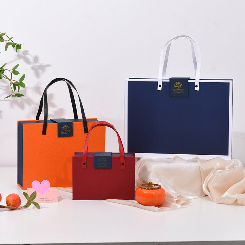 Geschenkbox-Set mit Klappdeckel: orange und dunkelblau, mit Tragegriffen