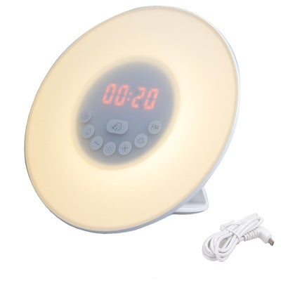 Round alarm clock radio with glowing red display, cream light, and control buttons