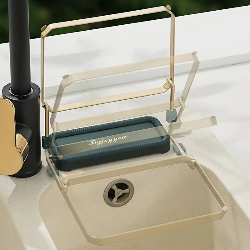 Side view of teal mat sink strainer rack with gold frame on sink divider